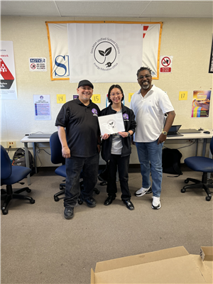 Mr. Alvarado from Merlo, his student Meilani who won the logo contest and Energy Education Specialist Jermaine Reece